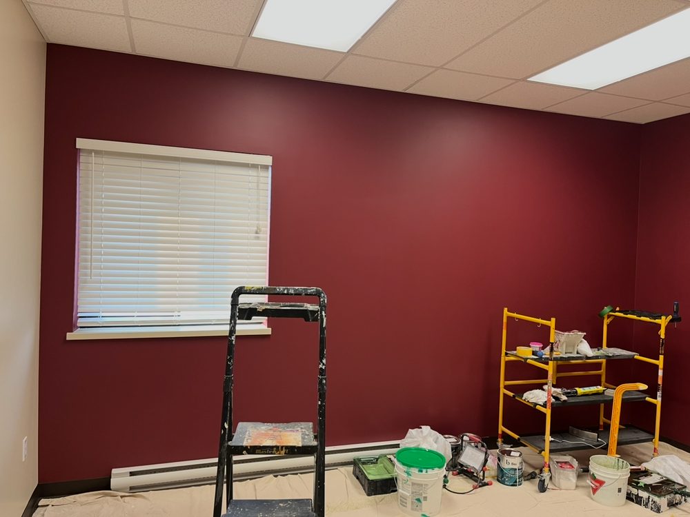 Finished deep burgundy feature wall in a Whitehorse office