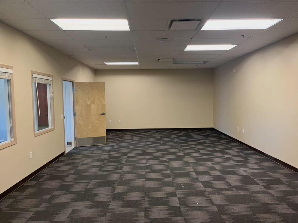 The same open office area finished in a warm off-white